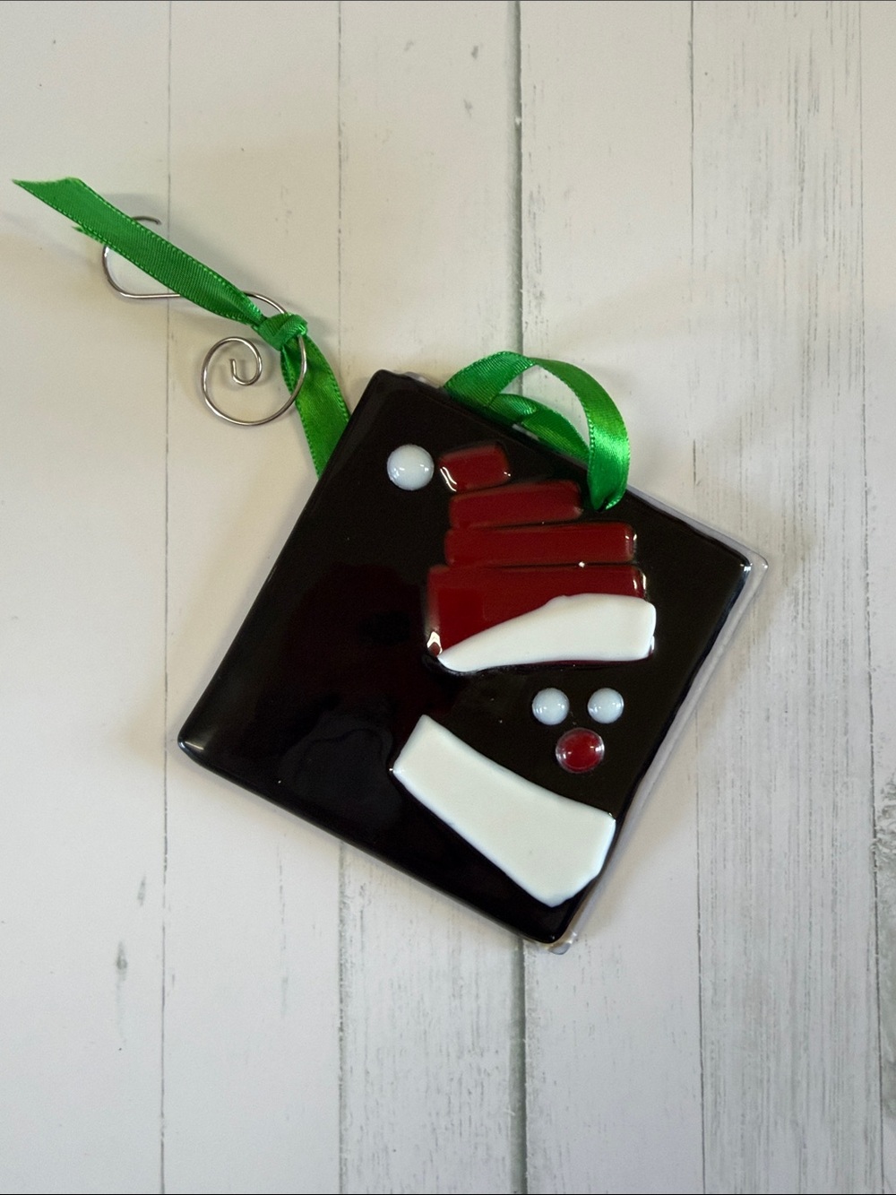 Artisan Black Glass Ornament with Red, White, and Green Accents